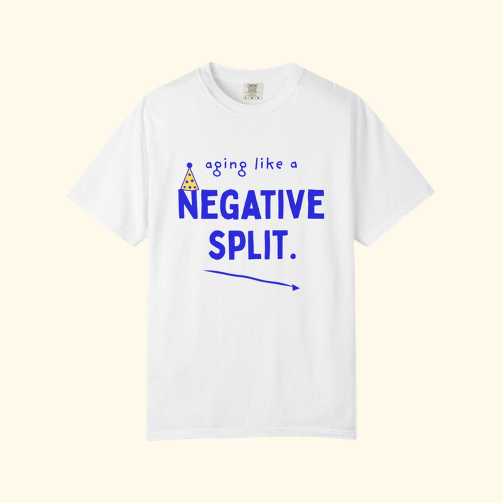 Aging Like a Negative Split white runner birthday t-shirt on a cream background