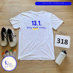 Only half crazy running tee flat lay with race bib and sneakers