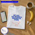 Flat lay of the Not Lost. Just Drawing a Dinosaur on Strava funny running shirt by Run & Tell