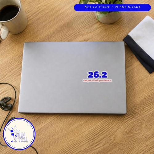 26.2 and Yes, I'll Tell You About It kiss-cut sticker on a laptop, shown at real 3 inch size