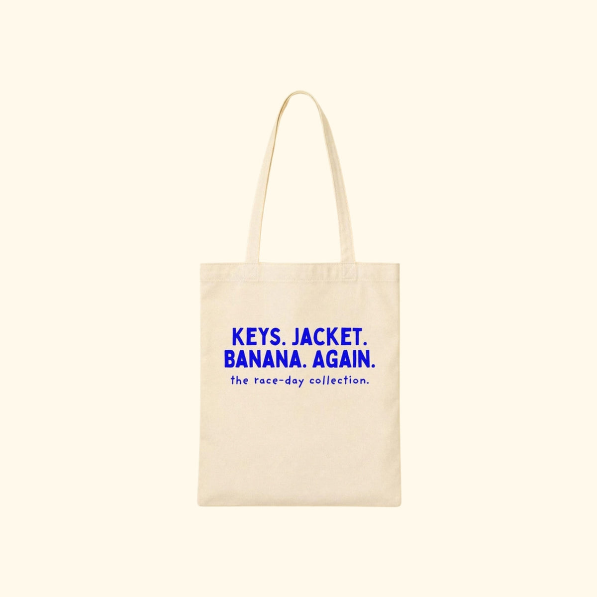 Keys. Jacket. Banana. Again. canvas tote on a cream background