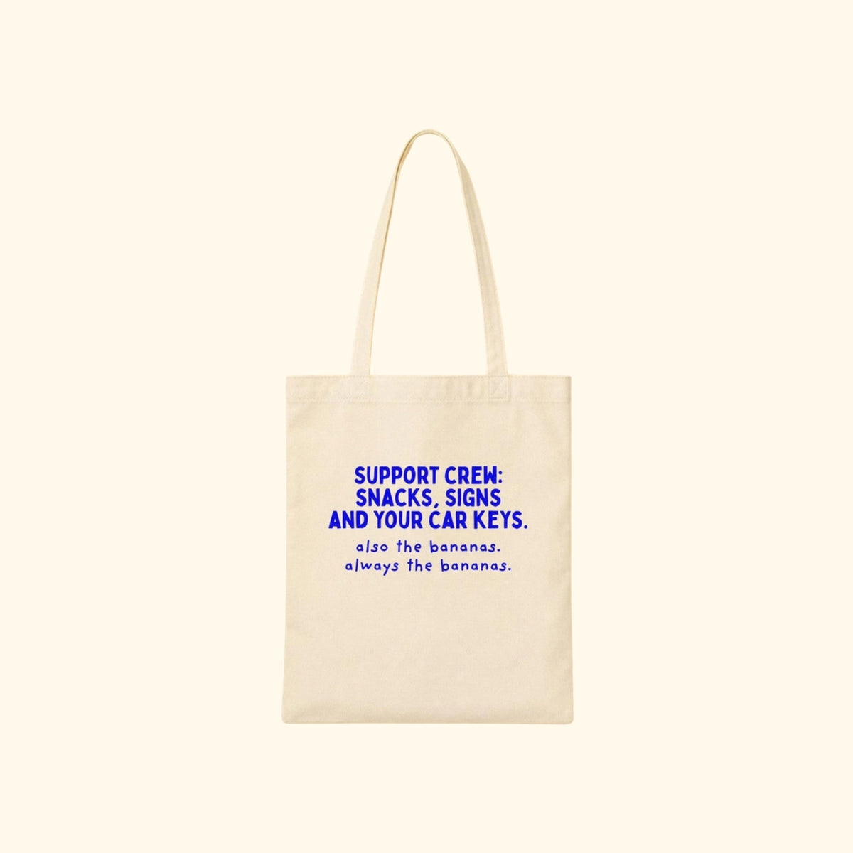 Support Crew: Snacks, Signs and Your Car Keys canvas tote on a cream background