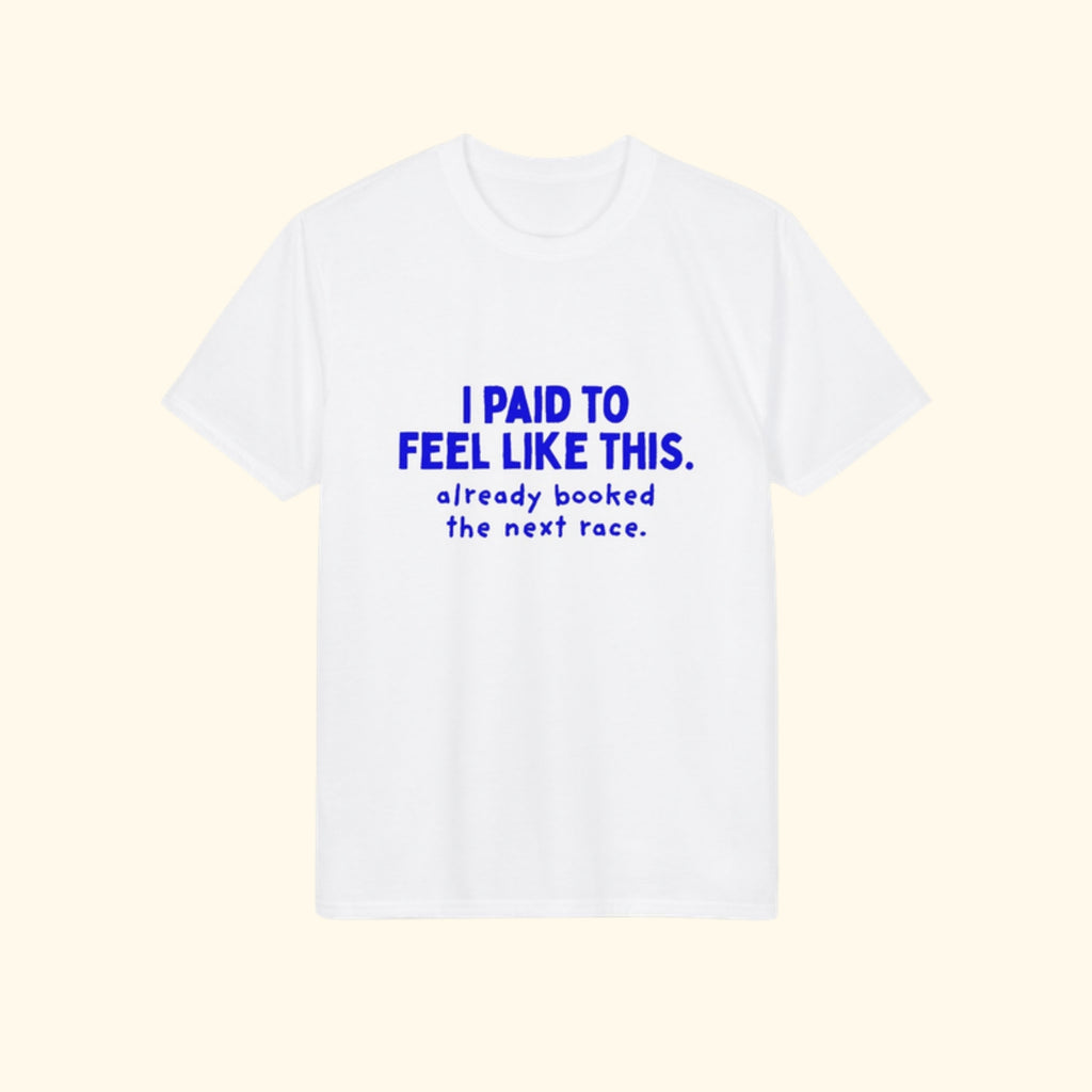 I Paid to Feel Like This white performance running t-shirt on a cream background