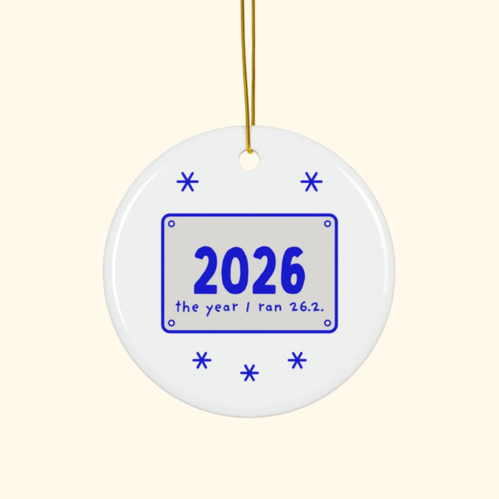 2026: The Year I Ran 26.2 marathon Christmas ornament on a cream background