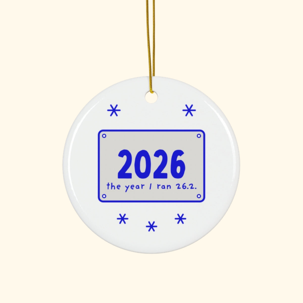 2026: The Year I Ran 26.2 marathon Christmas ornament on a cream background