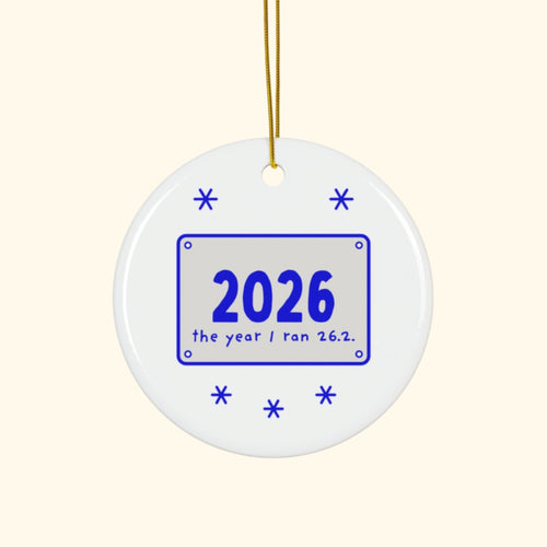 2026: The Year I Ran 26.2 marathon Christmas ornament on a cream background