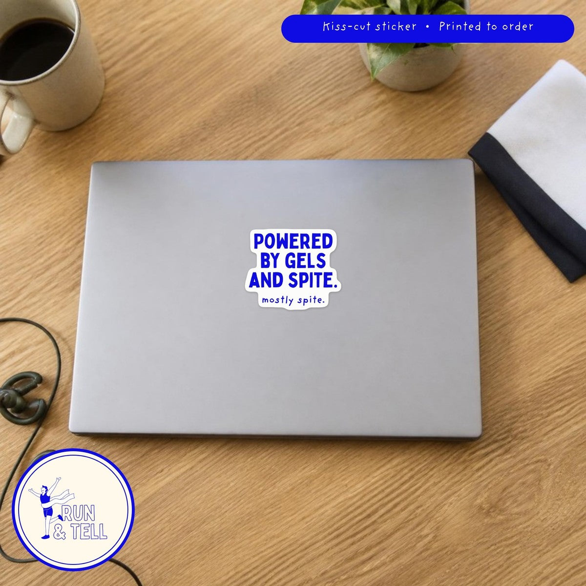Powered by Gels and Spite kiss-cut sticker on a laptop, shown at real 3 inch size