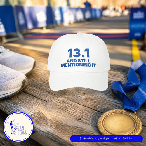 13.1 and Still Mentioning It embroidered dad hat on a finish line bench with a medal