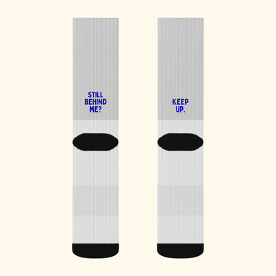 Still Behind Me? Keep Up. funny running socks, back view of the pair with the print above the heel